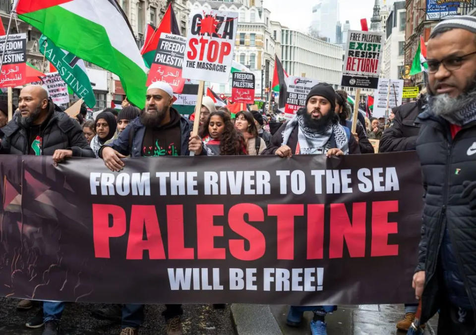 Participants holding anti-Israel banner during protest demonstration