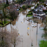 A drone view shows abandoned cars after heavy overnight rain caused roads to flood, leaving cars stranded in Manchester